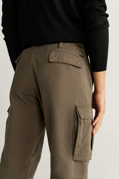 Khaki cargo pants with belt loops, button fly, and flap cargo pockets