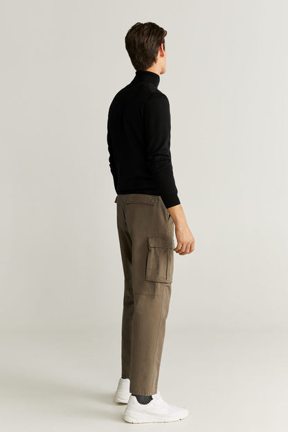 Khaki cargo pants, side view, with flap cargo pockets and cuffed hem