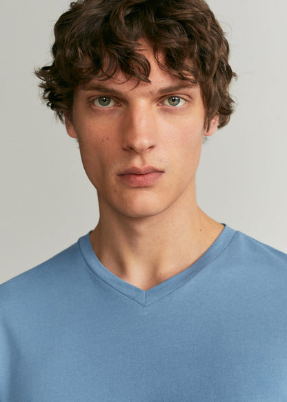 Men's light blue V-neck T-shirt neckline close-up, short sleeves