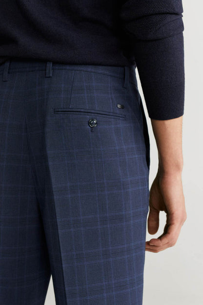 Men's dark navy plaid trousers front pocket with metal button detail