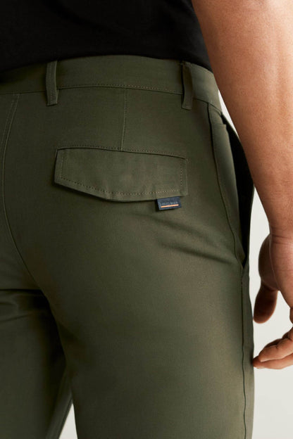 Khaki pants close-up of back pocket with stitched yoke and logo patch