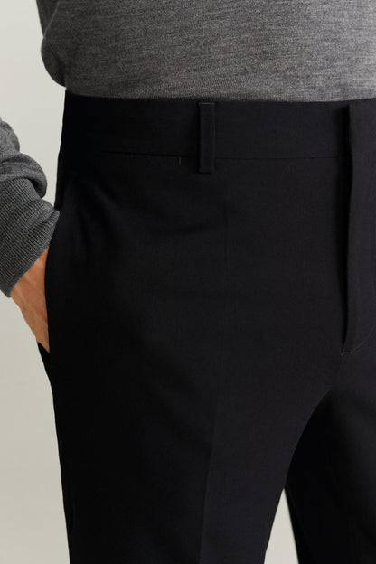 MANGO black trousers close-up of waistband, pleat, and front pocket