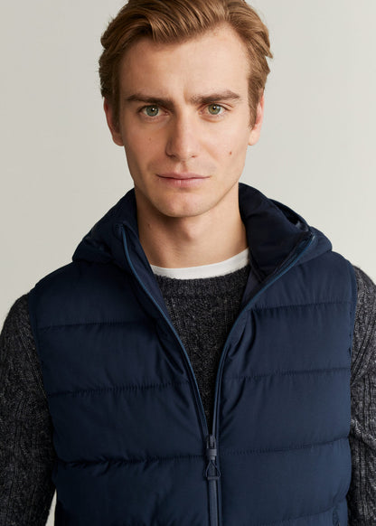 Dark navy quilted hooded puffer vest close-up with zip front