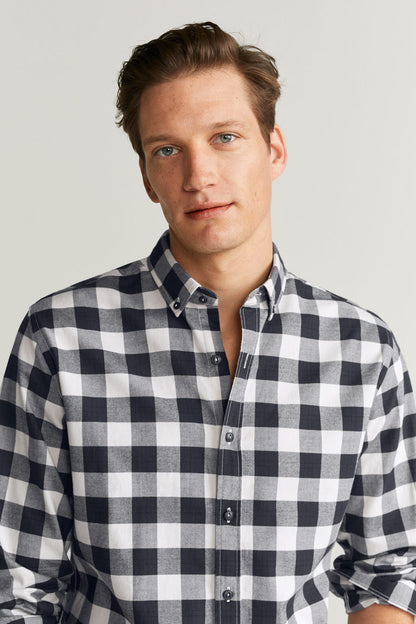 Dark blue and white checkered button-up shirt close-up of collar and buttons