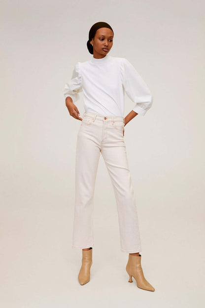 Off-white blouse with long sleeves and slight shoulder gathers
