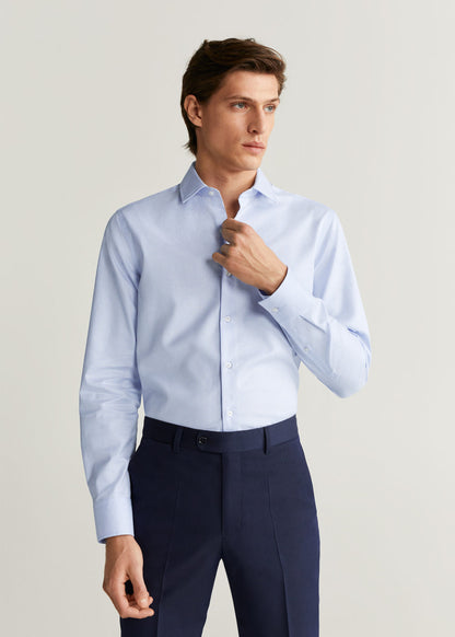 Light blue men's dress shirt with pointed collar and button front, long sleeves