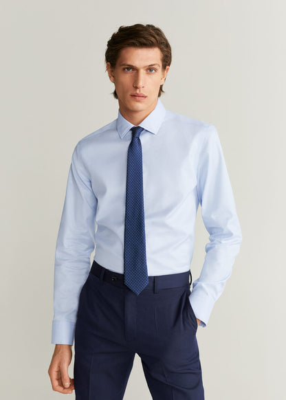 Light blue men's dress shirt with button front, pointed collar, long sleeves
