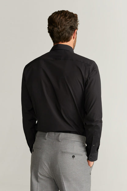 Black button-up dress shirt, long sleeves, back view with yoke.