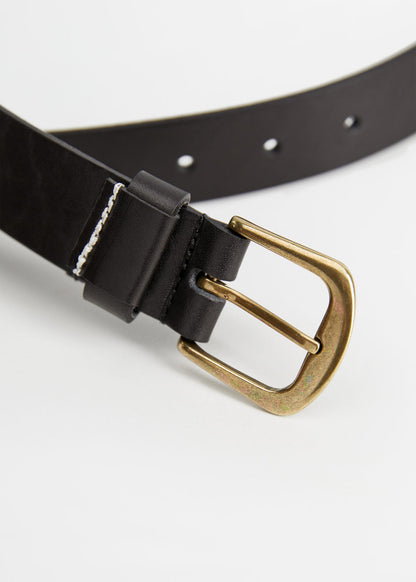 Close-up black leather belt with gold buckle and double-prong keeper