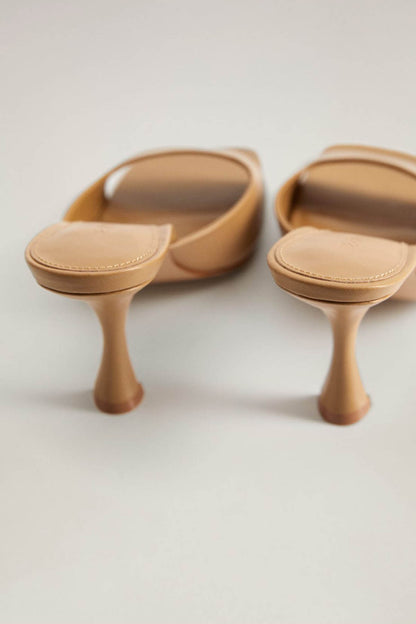 Brown heeled mules with open toe and curved block heel