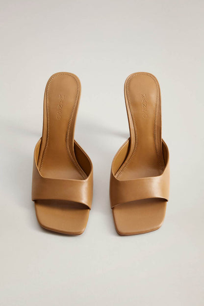 Brown platform mules with open toe, wide band upper, and block heel