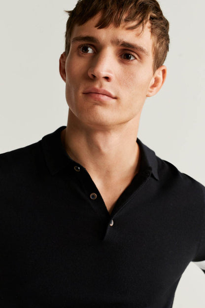 MANGO black polo shirt close-up with buttoned collar