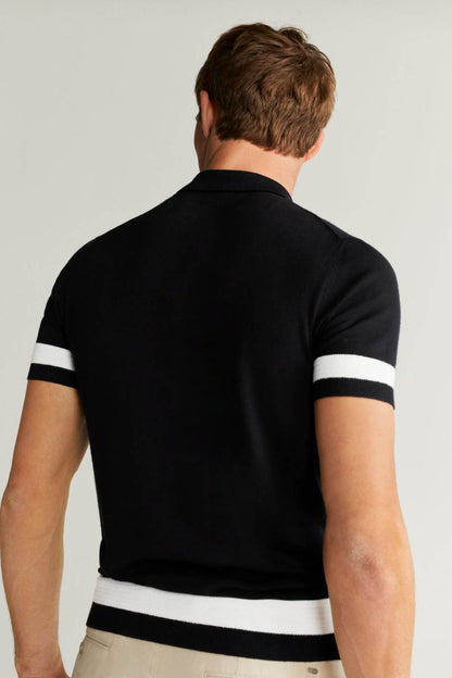 MANGO black polo shirt, back view, white striped cuffs and hem