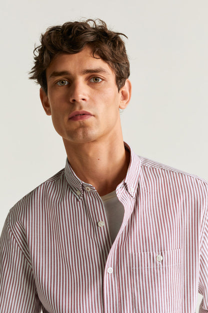 Pink-and-white striped button-up shirt with buttoned collar and placket