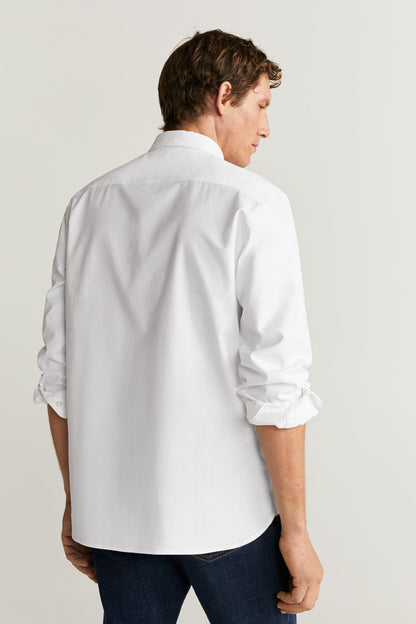 Men's white button-up shirt, back view with yoke and full-length sleeves