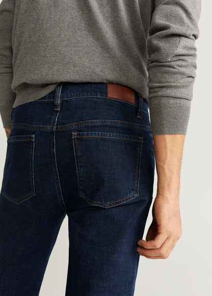 MANGO dark blue denim jeans close-up: straight fit and stitched back pockets