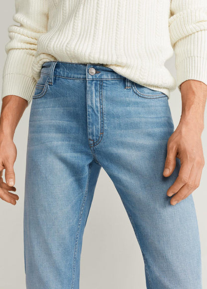 MANGO light wash denim jeans close-up at waistband with button fly