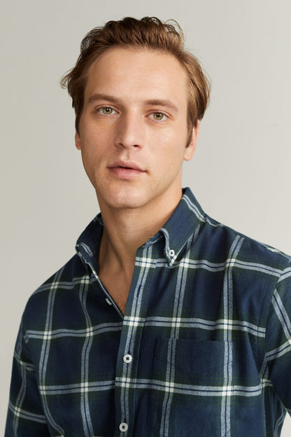Men's navy plaid button-up shirt with buttoned collar and front placket