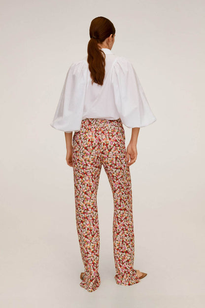 Floral print trousers shown from behind, straight legs and gathered waist