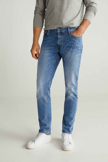 Men's medium-blue jeans with straight fit, belt loops, and button fly