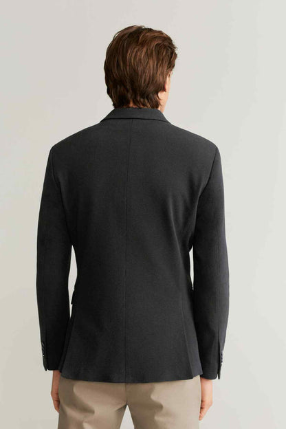 Black blazer back view with center back seam and long sleeves