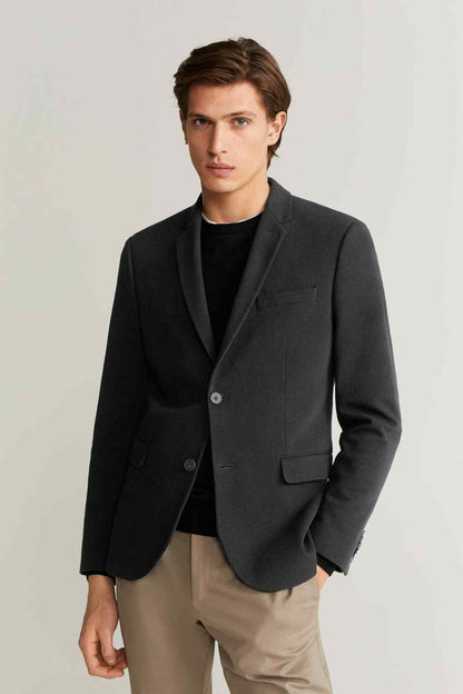 Black single-breasted blazer with notch lapels, two buttons, and flap chest pocket