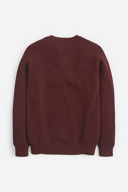 Rust crewneck knit sweater, back view, ribbed cuffs and hem