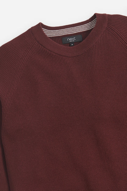 Rust knit sweater collar with ribbed crewneck and brand label