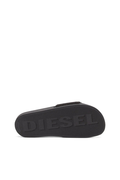 Black slide sandals, textured sole with raised DIESEL lettering