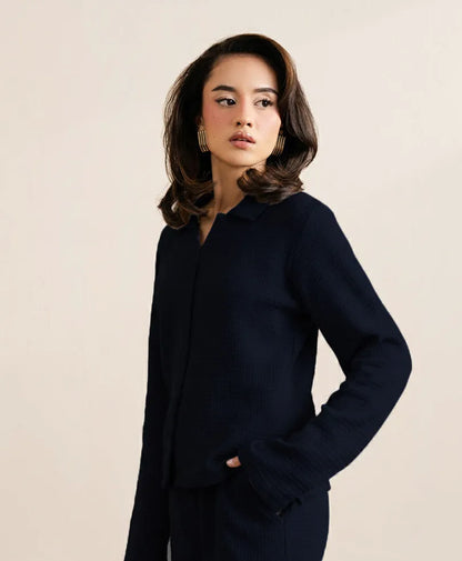 Navy zip-front jacket with stand collar and textured knit look