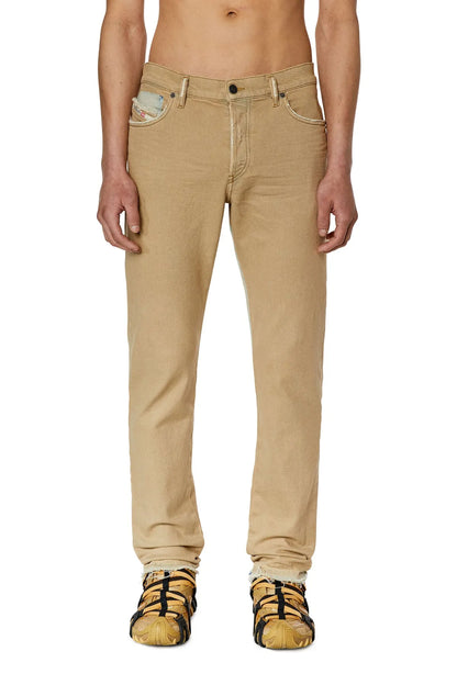 Diesel beige straight jeans with button fly, belt loops, and light distressed detailing