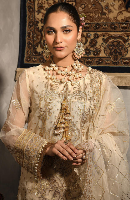 Cream embroidered dress with ornate bead and pearl embellishments, sheer sleeves