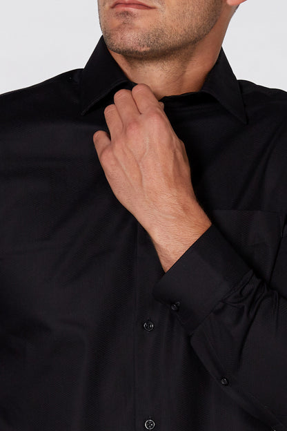 Men's black button-up shirt collar with hand-adjusted placket and visible buttons