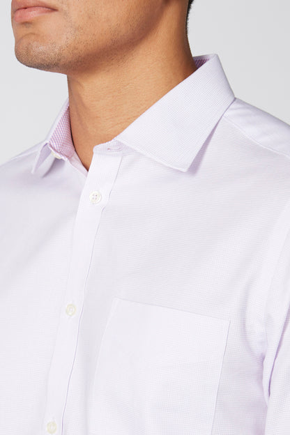 Men's dress shirt close-up: pointed collar, button placket, chest pocket
