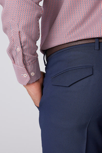 Men's blue dress pants close-up: front pocket, waistband, belt loops