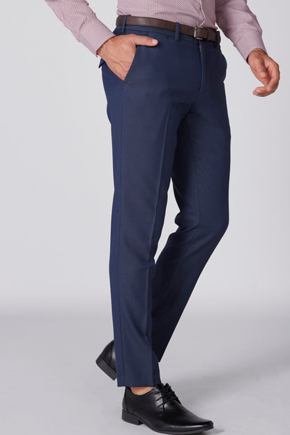 Men's blue dress pants with straight legs and cuffed hem, front view