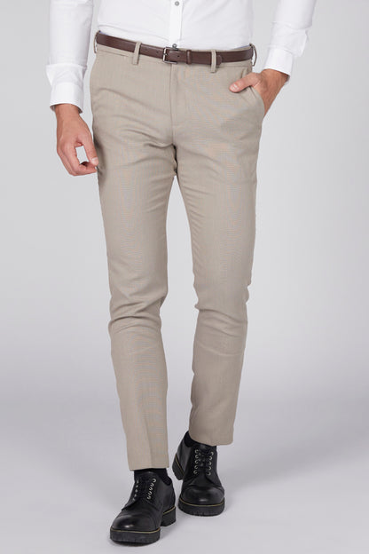 Beige slim-fit pants with brown belt, front view and tapered cuffs