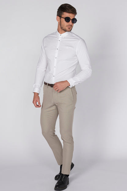 Beige slim-fit pants with brown belt, full-body side view