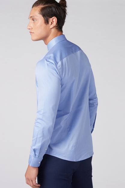Light blue button-up dress shirt shown in side profile
