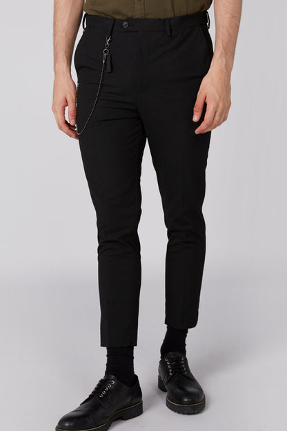 Splash black pants front view with drawstring side, cuffed ankle, chain accents