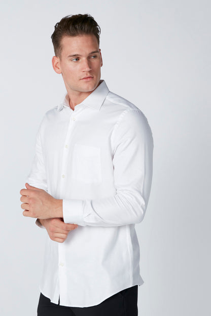 White button-up dress shirt with long sleeves and button front