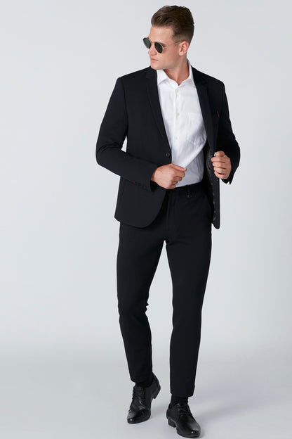 White button-up dress shirt with long sleeves and collar, under suit jacket