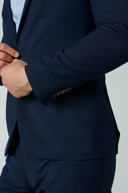 Men's navy blue suit jacket cuff with embroidered trim detail