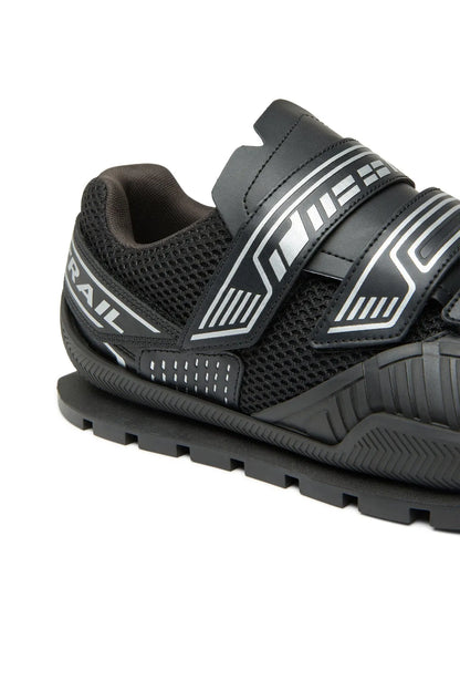 Black trail sneaker with mesh upper and striped logo detailing on side