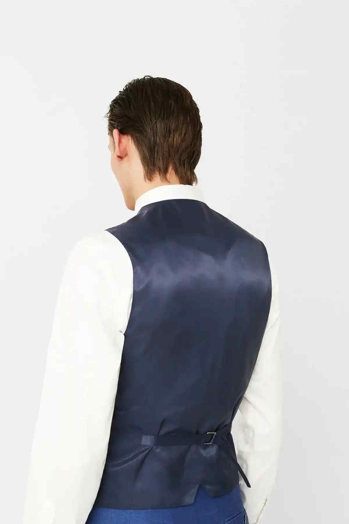Men's blue suit vest back view with adjustable strap detail