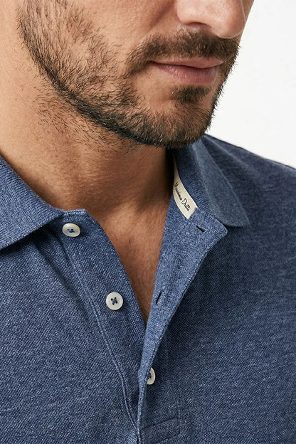 Close-up of navy heather polo shirt collar and buttons