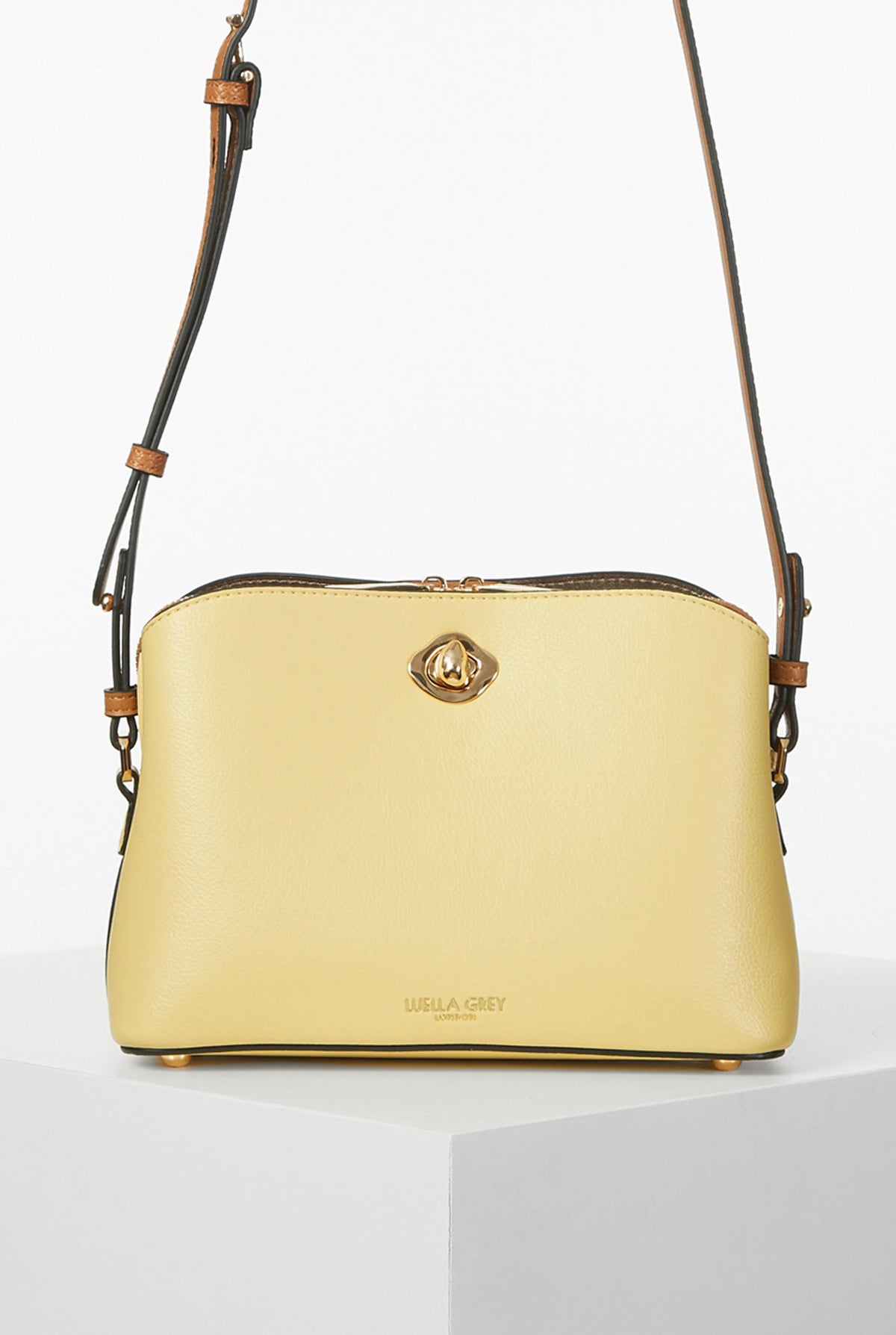 Yellow leather shoulder bag with gold logo clasp and adjustable strap