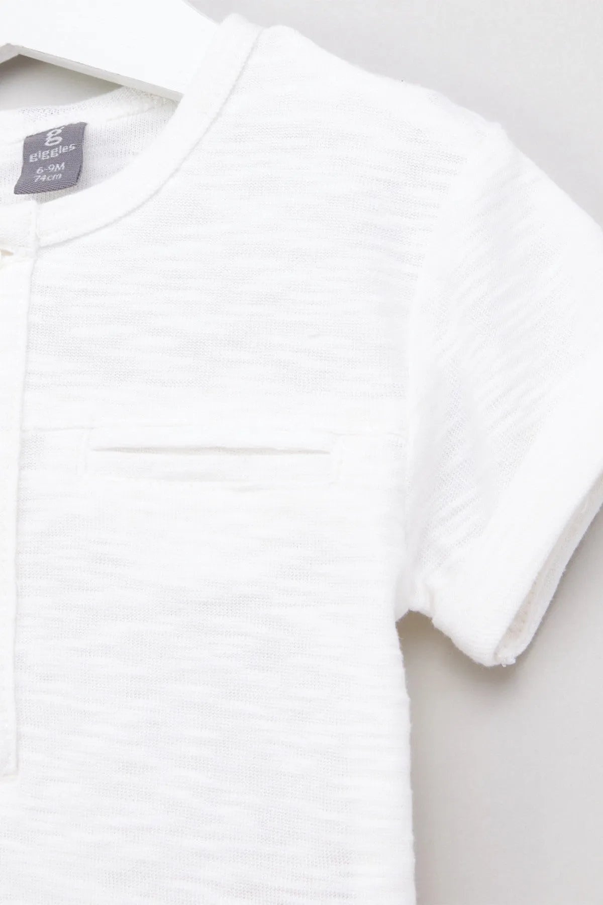 White short-sleeve polo shirt with button placket and collar