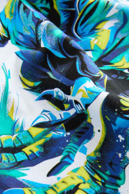 White kids T-shirt close-up of blue and teal dinosaur artwork