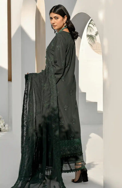 Bottle green long embroidered kurta from side view, sheer dupatta, layered hem